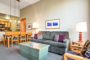 a living room with a couch and a table at Village 2105 in Mammoth Lakes