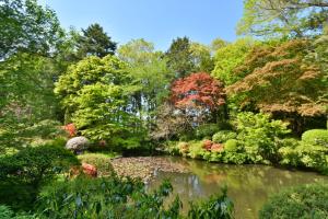 a garden with a pond in the middle at Hachinohe Park Hotel in Hachinohe