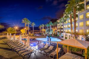a hotel with a swimming pool at night at Calheta Beach - All-inclusive - Savoy Signature in Calheta