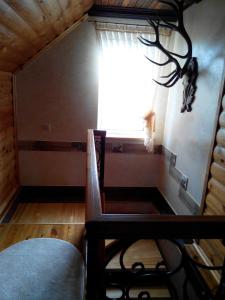 a room with a window and a table and a chair at Dom v Belovezhskoi Pushcie in Kamenyuky