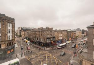an overhead view of a city street with cars and buses at The Lothian Road Residence in Edinburgh