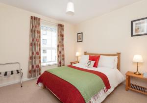 Voodi või voodid majutusasutuse The Holyrood Road Residence toas