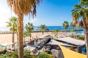 a view of a beach with palm trees and the ocean at Calheta Beach - All-inclusive - Savoy Signature in Calheta