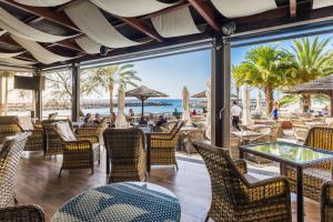 a restaurant with a view of the beach at Calheta Beach - All-inclusive - Savoy Signature in Calheta