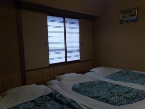 Krevet ili kreveti u jedinici u objektu Hotel Edoya
