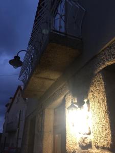a building with a light on the side of it at Casas do Terreiro in Seia