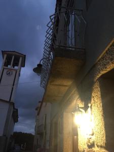 a building with a light on the side of it at Casas do Terreiro in Seia