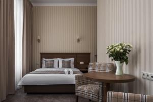 Кровать или кровати в номере Отель Дэтоль