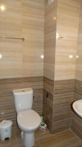 a bathroom with a toilet and a sink at Akrotiria Beach Apart Complex in Nesebar +66 photos