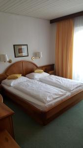 Postel nebo postele na pokoji v ubytování Hotel Kanz