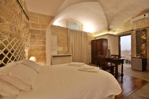 Krevet ili kreveti u jedinici u objektu Chiesa Greca - SIT Rooms & Apartments