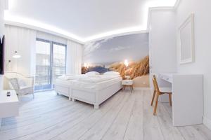 Posteľ alebo postele v izbe v ubytovaní Apartamenty Sun & Snow Sopocka Rezydencja
