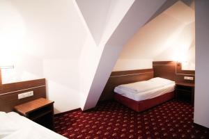 Postel nebo postele na pokoji v ubytování Hotel-Gasthof Obermeier