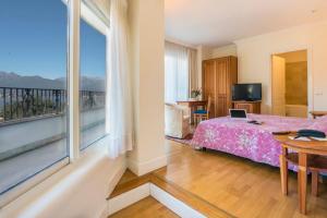 Postel nebo postele na pokoji v ubytování Hotel Royal
