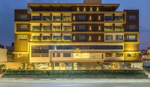 a tall building with a lot of windows at Hotel Abika Elite in Ujjain