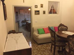 a living room with a couch and a table at La Casa di Luigi in Montevarchi +21 photos