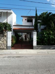 a house with a gate in front of it at Room in Cancun Stadium in Cancún