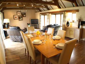 A television and/or entertainment centre at Polean Farm Cottages - With Free Animal Feeding and Pony Rides and Free Access to a Nearby Pool