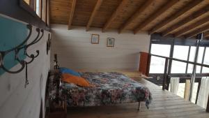 Katil atau katil-katil dalam bilik di Gran Cabaña en Villa Yacanto