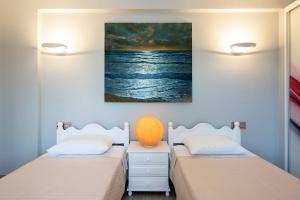 Posteľ alebo postele v izbe v ubytovaní Girasole Villa