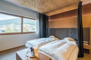 Postel nebo postele na pokoji v ubytování Hotel Hell