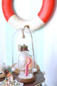 a glass jar with a snake in it on a table at B&B Il Tentacolo in Ventimiglia