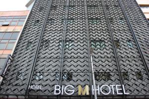 a large building with a sign on the side of it at BIG M Hotel in Kuala Lumpur
