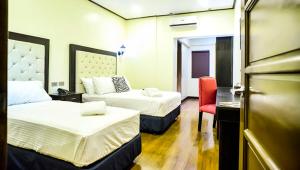 Katil atau katil-katil dalam bilik di The Ambassador Hotel