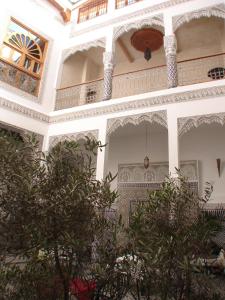 a building with trees in front of it at Riad Sheryne Fes in Fez