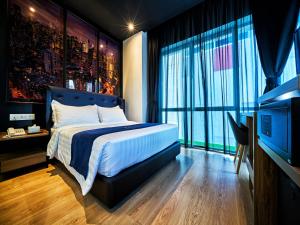 Postel nebo postele na pokoji v ubytování Manhattan Business Hotel TTDI