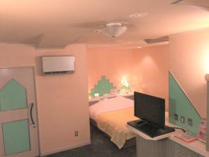 Postel nebo postele na pokoji v ubytování Hotel Plage (Adult Only)