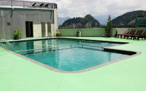 a swimming pool on top of a building at Tower Regency Hotel & Apartments in Ipoh