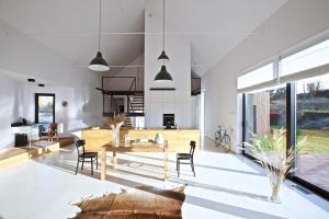 a kitchen and living room with a table and chairs at Dom na jurze in Zawiercie