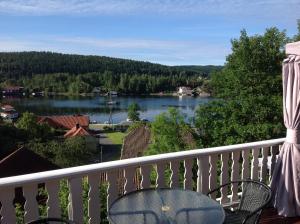 a view of a lake from a balcony at Torill`s Apartment in Kragerø