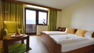 Postel nebo postele na pokoji v ubytování Hotel Restaurant Stigenwirth