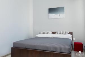 Posteľ alebo postele v izbe v ubytovaní Jantar Apartamenty Lighthouse Port Kołobrzeg