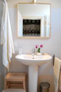 a bathroom with a sink and a mirror at Burro e Marmellata in Sabbioncello +15 photos