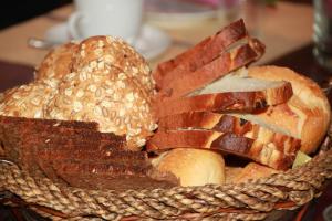 a basket filled with bread and bacon on a table at BG Nautico Ebeso in Ibiza Town
