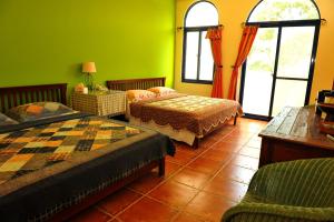 Postel nebo postele na pokoji v ubytování Tuscany Garden B&B