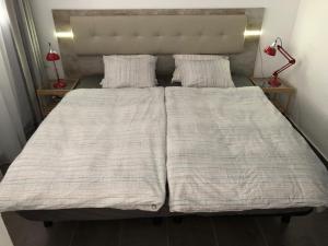Posteľ alebo postele v izbe v ubytovaní Yumbo Apartments + 12 fotografií