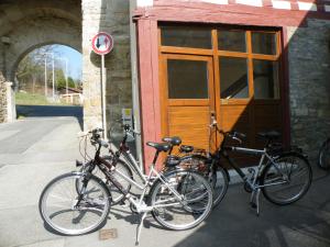three bikes parked in front of a building at Jakobsturm Ferien im Turm in Röttingen