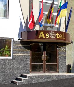 a building with a flag on the front of it at Asotel in Kharkiv