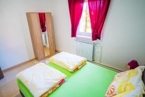 Posteľ alebo postele v izbe v ubytovaní Tina Rooms