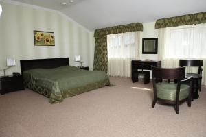 Lavina Hotel tesisinde bir odada yatak veya yataklar