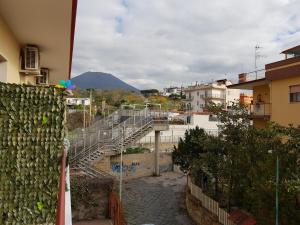 a stairway in a city with a mountain in the background at La Casa di Ercole B&B in Ercolano
