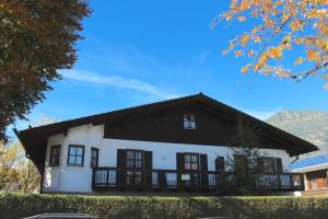 a white house with a black roof at Carina, Martin, Michael & Sissi in Garmisch-Partenkirchen