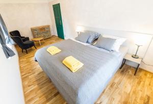Posteľ alebo postele v izbe v ubytovaní Babylon Apartmány