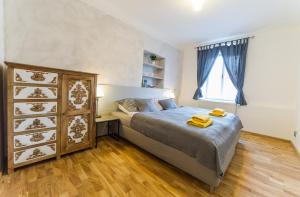 Posteľ alebo postele v izbe v ubytovaní Babylon Apartmány