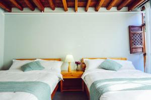 Postel nebo postele na pokoji v ubytování Log Cabin