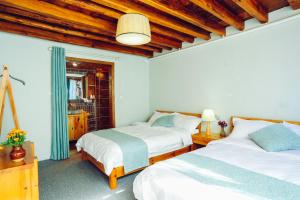 Postel nebo postele na pokoji v ubytování Log Cabin